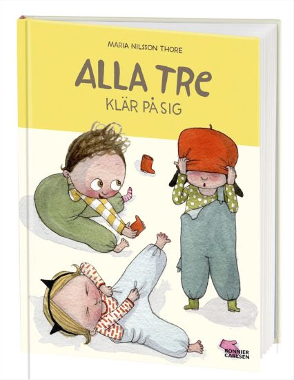 Alla tre klär på sig